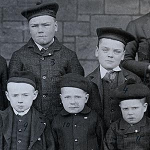 Mr & Mrs Lang with the boys of Cottage 13, 'Leven Home' in 1886 prior to the boys' departure for Canada on April 7th 1886