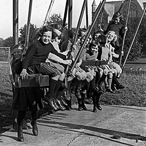 Children playing on the American swing